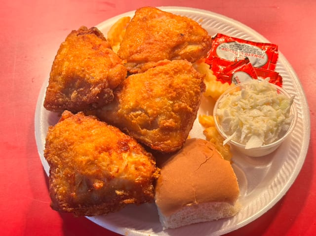 4 PC Thigh Dinner Includes Fries,Slaw & Roll.